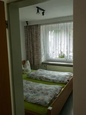 Ein Bett oder Betten in einem Zimmer der Unterkunft Pension Glückauf
