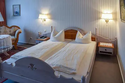 Ein Bett oder Betten in einem Zimmer der Unterkunft Landhotel Schnupp