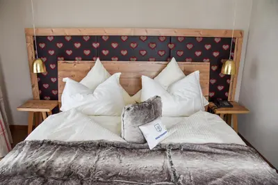 Ein Bett oder Betten in einem Zimmer der Unterkunft Landhotel Schnupp