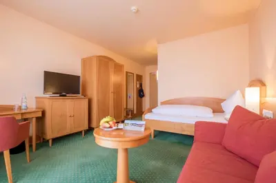 Ein Bett oder Betten in einem Zimmer der Unterkunft Gesundheitshotel Weißenstadt am See