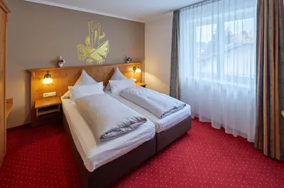 Ein Bett oder Betten in einem Zimmer der Unterkunft Hotel-Gasthof-Fellner