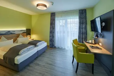 Ein Bett oder Betten in einem Zimmer der Unterkunft Hotel-Gasthof-Fellner