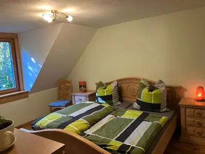 Ein Bett oder Betten in einem Zimmer der Unterkunft Grünlasmühle