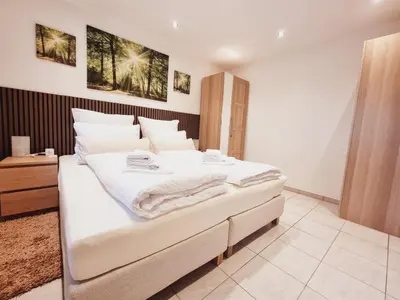 Ein Bett oder Betten in einem Zimmer der Unterkunft Tom's FeWo - Keine Monteure