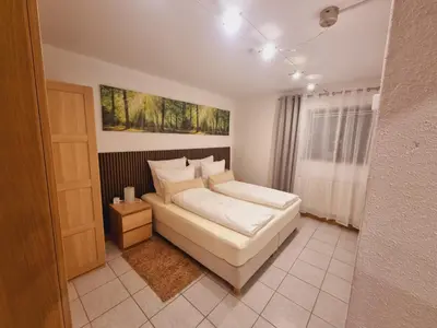 Ein Bett oder Betten in einem Zimmer der Unterkunft Tom's FeWo - Keine Monteure