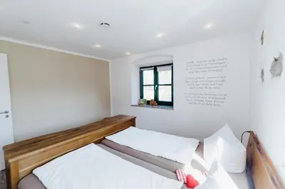 Ein Bett oder Betten in einem Zimmer der Unterkunft Müllner-Hof
