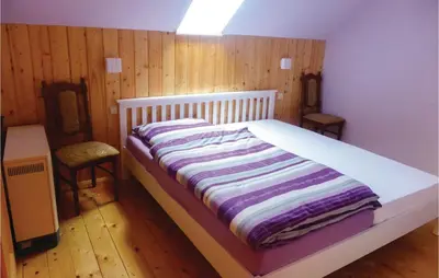 Ein Bett oder Betten in einem Zimmer der Unterkunft Cozy Apartment In Auerbach Ot Grünheide