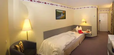 Ein Bett oder Betten in einem Zimmer der Unterkunft Hotel Restaurant Lohmühle