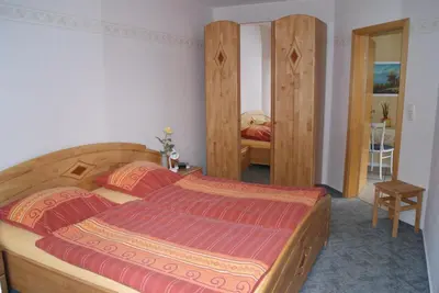 Ein Bett oder Betten in einem Zimmer der Unterkunft Ferienwohnungen Elsterblick Bad Elster