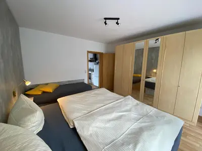 Ein Bett oder Betten in einem Zimmer der Unterkunft Ferienwohnungen Elsterblick Bad Elster