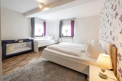Ein Bett oder Betten in einem Zimmer der Unterkunft Zweck's Ferienwohnung