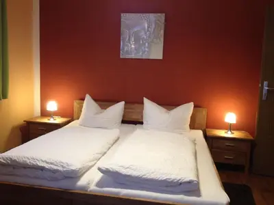 Ein Bett oder Betten in einem Zimmer der Unterkunft Zweck's Ferienwohnung