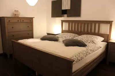 Ein Bett oder Betten in einem Zimmer der Unterkunft Ferienwohnung Familie Becher Klingenthal Aschberg