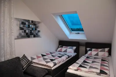 Ein Bett oder Betten in einem Zimmer der Unterkunft Tannenblick-Franken