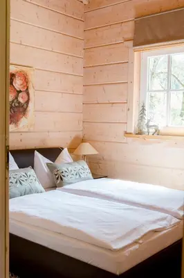 Ein Bett oder Betten in einem Zimmer der Unterkunft Jagdhaus zur Bischofsmühle