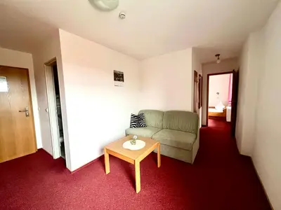 Ein Sitzbereich in der Unterkunft Hotel Zum Alten Brauhaus