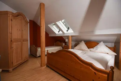 Ein Bett oder Betten in einem Zimmer der Unterkunft Jagdschloss Fahrenbühl Hotel Garni