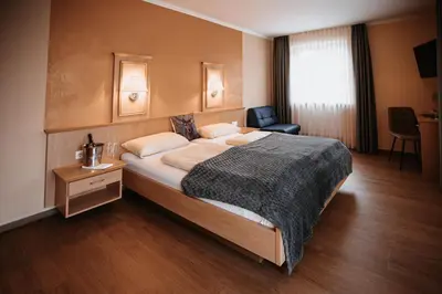 Ein Bett oder Betten in einem Zimmer der Unterkunft Landhaus Schönfelder Hof