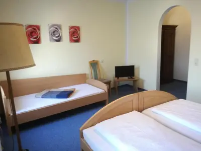 Ein Bett oder Betten in einem Zimmer der Unterkunft Garni Hotel Post