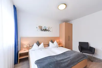 Ein Bett oder Betten in einem Zimmer der Unterkunft Gasthof Kolb