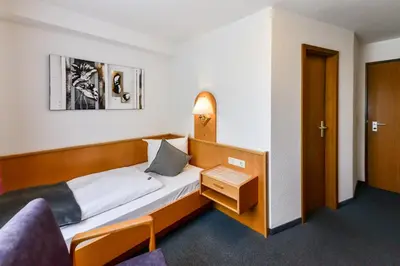 Ein Bett oder Betten in einem Zimmer der Unterkunft Gasthof Kolb