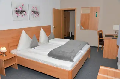 Ein Bett oder Betten in einem Zimmer der Unterkunft Gasthof Kolb