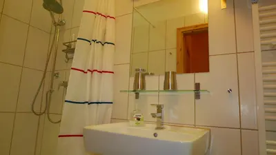 Ein Badezimmer in der Unterkunft Reusa Apartments