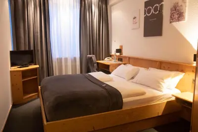 Ein Bett oder Betten in einem Zimmer der Unterkunft Hotel Stadtkrug