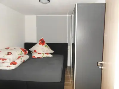 Ein Bett oder Betten in einem Zimmer der Unterkunft Ferienwohnung Kreischer