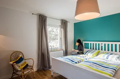 Ein Bett oder Betten in einem Zimmer der Unterkunft Ferienwohnung Holl