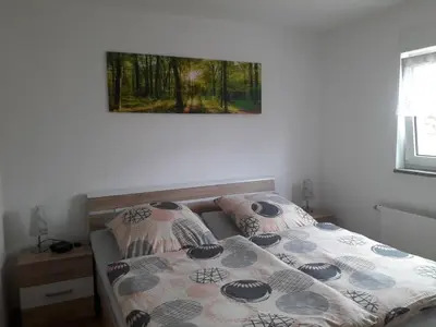 Ein Bett oder Betten in einem Zimmer der Unterkunft Ferienwohnung Rockmann