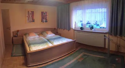 Ein Bett oder Betten in einem Zimmer der Unterkunft Haus Bergzauber