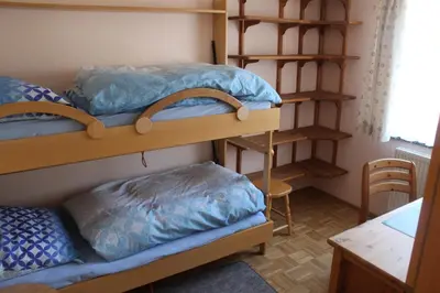 Ein Bett oder Betten in einem Zimmer der Unterkunft Ferienwohnung Korn mit Tiefgarage und Skiraum