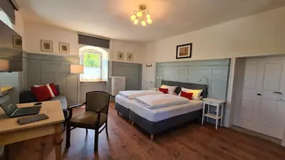 Ein Bett oder Betten in einem Zimmer der Unterkunft Landhausgarten Bunzmann