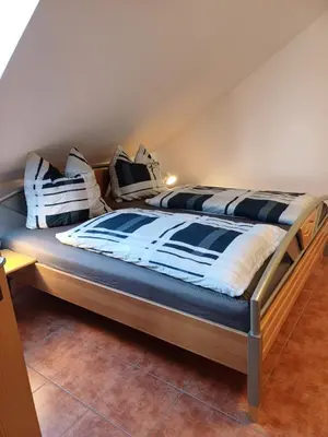 Ein Bett oder Betten in einem Zimmer der Unterkunft Pension und Gasthof Reithmeier