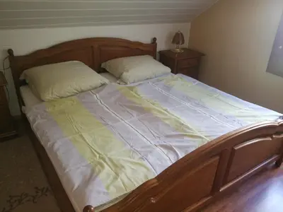 Ein Bett oder Betten in einem Zimmer der Unterkunft Ferienwohnung am Aschberg