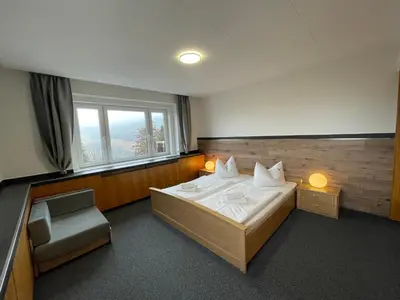 Ein Bett oder Betten in einem Zimmer der Unterkunft Ferienhaus Freitag - Ferienwohnungen mit Sauna & Frühstück