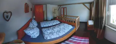 Ein Bett oder Betten in einem Zimmer der Unterkunft Ferienwohnungen zur Post - 102