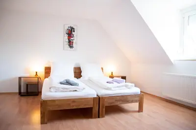 Ein Bett oder Betten in einem Zimmer der Unterkunft Ferienwohnungen Windischeschenbach by HausGruenerBaum