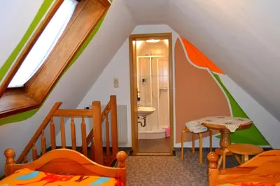 Ein Bett oder Betten in einem Zimmer der Unterkunft Landgasthof und Pension Erzgebirgsstübel
