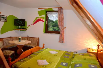 Ein Bett oder Betten in einem Zimmer der Unterkunft Landgasthof und Pension Erzgebirgsstübel