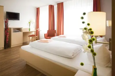 Ein Bett oder Betten in einem Zimmer der Unterkunft Hotel Gasthof Pension Riebel