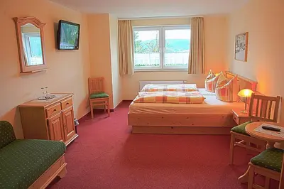 Ein Bett oder Betten in einem Zimmer der Unterkunft Pension Am Zechengrund