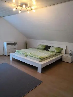 Ein Bett oder Betten in einem Zimmer der Unterkunft Ferienwohnung Schmeisser