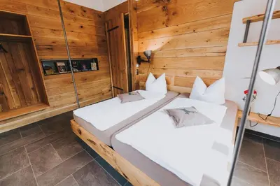 Ein Bett oder Betten in einem Zimmer der Unterkunft Luxus-Chalet am Fluss