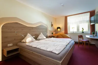 Ein Bett oder Betten in einem Zimmer der Unterkunft Landgasthof Zum Schützenhaus Sosa