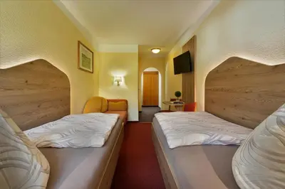 Ein Bett oder Betten in einem Zimmer der Unterkunft Landgasthof Zum Schützenhaus Sosa