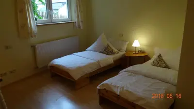 Ein Bett oder Betten in einem Zimmer der Unterkunft Ferienwohnung Weitermann
