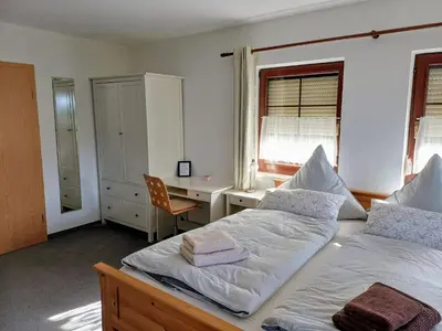 Ein Bett oder Betten in einem Zimmer der Unterkunft Pumphuts Scheune Ferienwohnungen Nr 1 - 4 beim Freizeitpark Plohn