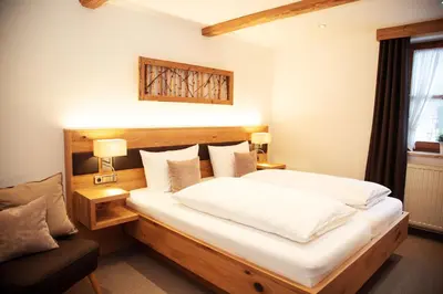 Ein Bett oder Betten in einem Zimmer der Unterkunft Pension Sommer